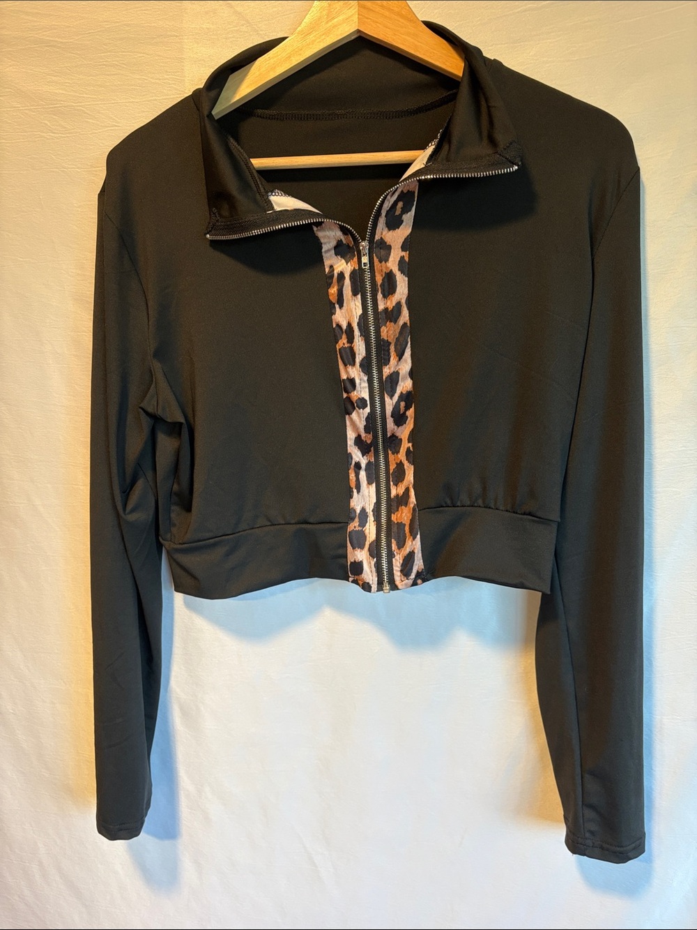 Black Cropped Zip Jacket with Leopard Trim
Size: L